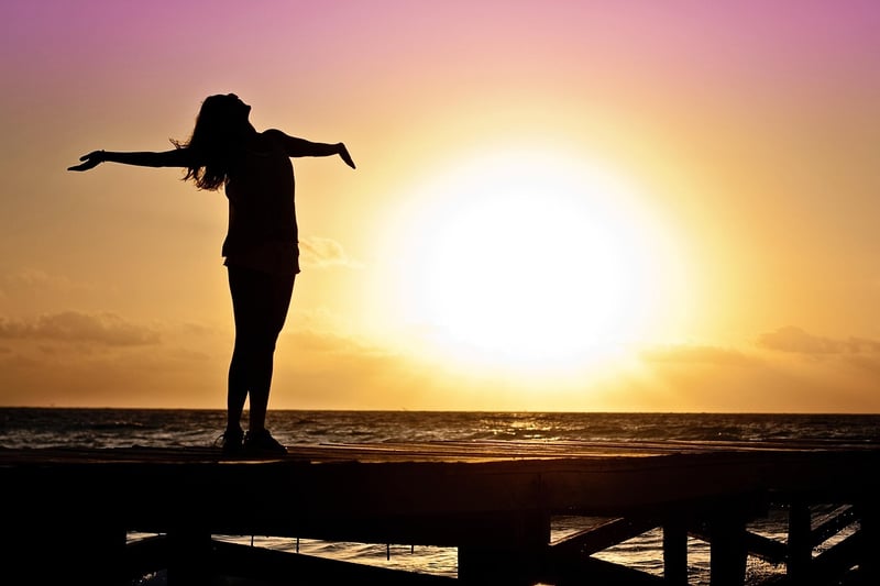 Woman Enjoying Sunrise